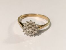 A 9ct gold diamond set cluster ring, size N.