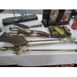 A set of brass fire irons, other fire implements and a quantity of brass hinges.