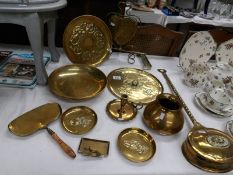 A mixed lot of brass ware including candle holder, vase, dinner gong etc.