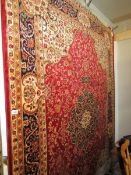 A red ground Keshan carpet, 230 x 200 cm.