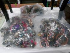 3 large bags of assorted costume jewellery.