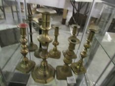 8 brass candlesticks.