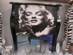 A 2 drawer chest depicting Marilyn Monroe.