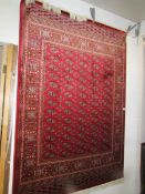 A red ground Bokhara rug, 190 x 140 cm.