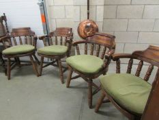 A set of 4 Captain's chairs,