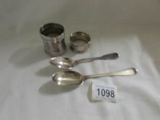 2 silver napkin rings, a silver spoon (hall mark indistinct) and a London silver spoon.