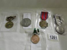 A 1930-45 Polish war medal, a 1914-18 Belgian fire cross, a South African Republic medal 1961,