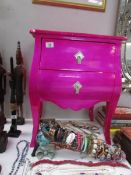 A pink 2 drawer chest,
