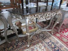 A silver coloured console table.