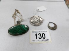 A silver St, Christopher, silver pendant on chain and an Egyptian pendant.