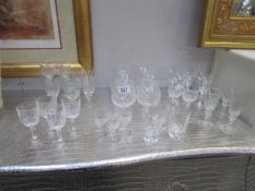 A mixed lot of cut glass drinking glasses.