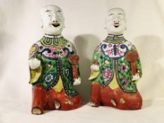 A pair of early 19th century Chinese pottery laughing boys (He-He boys)