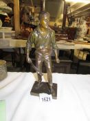 A rare bronze figure of a tennis player (1 of the Renshaw Brothers) holding a squared headed racket.