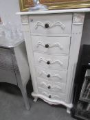 A white painted 6 drawer French style chest