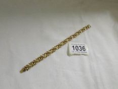 A ladies gold bracelet set with pearls and stamped with German hallmark. (total weight 19 grams).