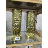 A pair of brass 'Trench' art vases.