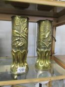 A pair of brass 'Trench' art vases.