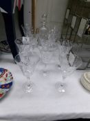 A cut glass decanter and 10 cut glass wine goblets.