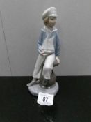 A Lladro boy with yacht (4810).