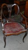 An Edwardian mahogany inlaid chair.