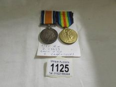 A WW1 war medal and victory meal for C Carruthers.