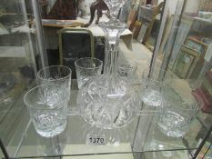 A decanter and 6 whisky tumblers.