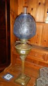 A Victorian brass Corinthian column oil lamp.