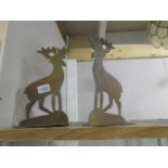 A pair of brass arts and crafts deer fireside dogs.