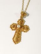 An 18ct gold cross on 18ct gold chain