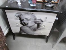 A 3 drawer chest depicting Marilyn Monroe