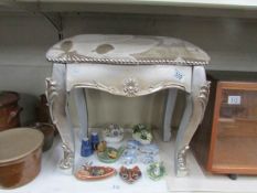 A silver coloured stool