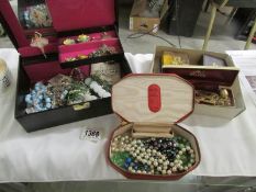 A jewellery box containing costume jewellery and 2 boxes of costume jewellery.