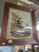 A framed Victorian wool work depicting a gentleman hunter / poacher smoking a pipe.