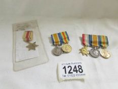 A WW" miniature African star, Victory medal and war medal together with A WW1 star,