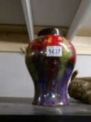 A Royal Doulton Flambe' vase.