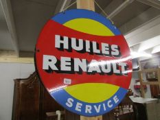 A circular Huiles Reavaut enamel sign.
