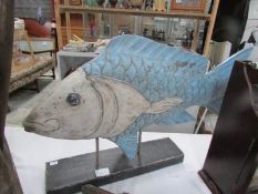 A wooden fish ornament.