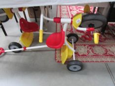 2 Fisher Price trikes.