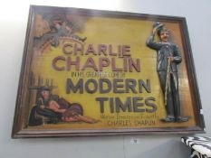 A modern Charlie Chaplin wall plaque.