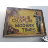 A modern Charlie Chaplin wall plaque.