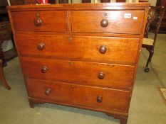 An oak 2 over 3 chest of drawers.