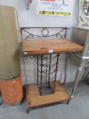 A wrought iron and wood wine rack.