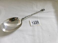 A silver anointing spoon with Lincoln imp finial, Birmingham 1911/12, Approximately 56 grams.