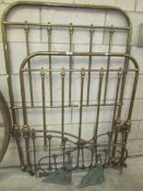A pair of single brass bed ends etc.