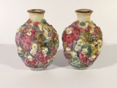 A very rare pair of circa 19th century snuff bottles, moulded 18 Louhan figures riding tigers,