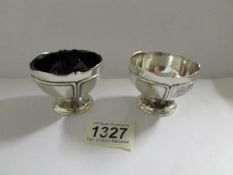 A pair of silver salts (one missing blue liner)