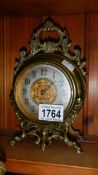 An Edwardian brass mantel clock.