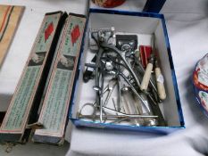 A mixed lot of old hairdressing clippers, waving irons etc.