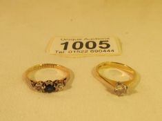 An 18ct gold solitaire ring size K and an 18ct gold ring set with sapphire and 2 diamonds,