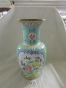 A late Qing Chinese enamel vase, approximately 30cm tall.